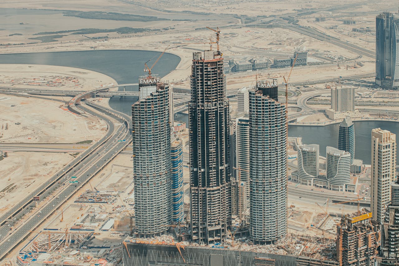 Aerial view of construction in downtown Dubai showcasing modern skyscrapers and urban development.